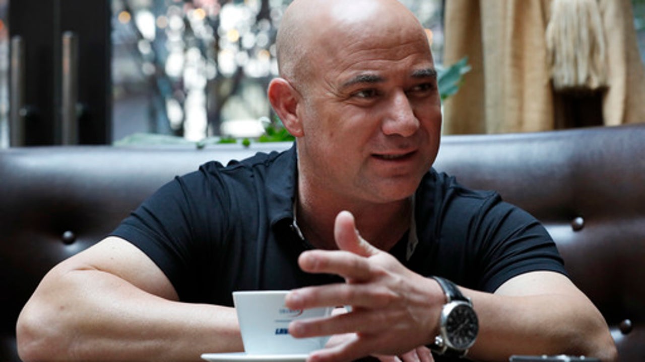 10 years after last pro match, Andre Agassi visits US Open